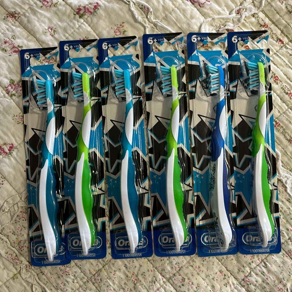 Oral-B Crossaction SOFT manual toothbrushes. 3 green. 3 blue. 6 yrs+